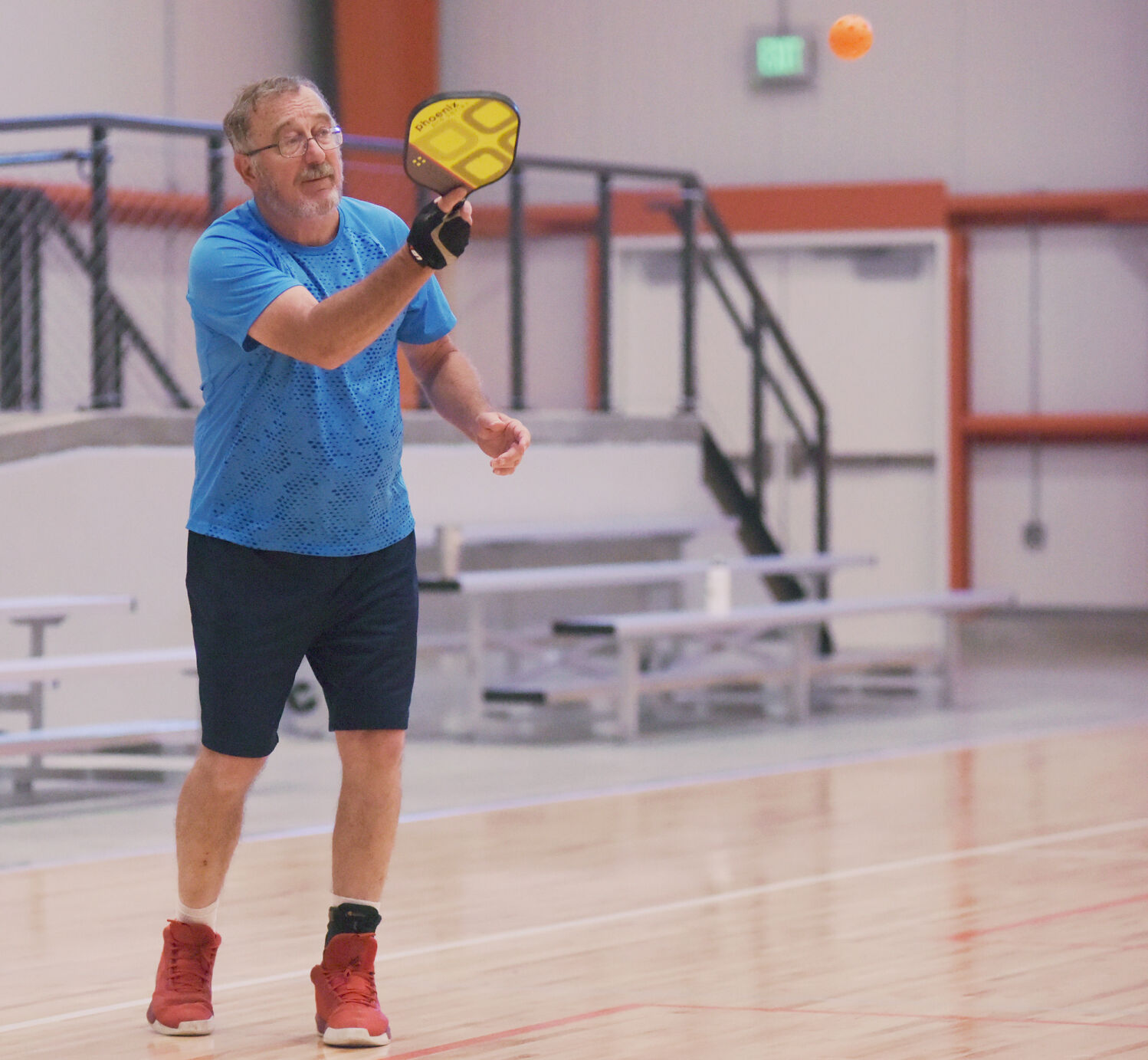 Bob Cockerham serves the ball